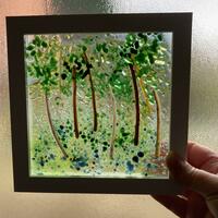 Transparent glass panel with trees