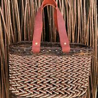 Contemporary zig zag weave catalan style oval based shopping basket large handbag with funky orange leather over arm leather riveted straps handles.  Made by Clare Shilvock with colourful Warwickshire Willow (L:38cm x W:16cm x H:36cm)
