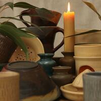 A selection of functional pottery. (Mugs, candlestick holders, wax burners, bowls etc.)