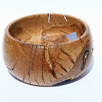 Oak burr with bark inclusions and stress cracks.