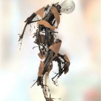 dancing figure, sculpture with twigs and lightbulb
