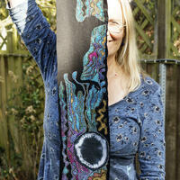 'Crow banner 4'. Embroidery silks, tie dye and acrylic fabric medium on black cloth. 17cm by 107 cm.,