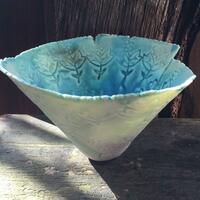Turquoise vessel with porcelain glaze.