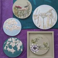 series of plaster cast botanical  tiles 