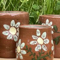 Earthenware with floral slip decoration