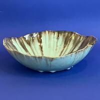 Glazed bowl with jagged rim.