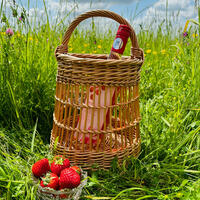 Fitched Buff Basket Round Base Kisheen with handle Clare Shilvock Warwickshire Willow in Summer meadow with wine and strawberries