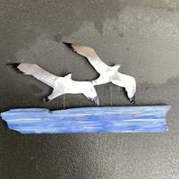 Two Gulls, shiny tiny- discarded beercans and wood