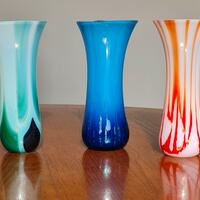 Three fused glass drop vases.  1 in a range of green and blues. 2 blue with dichroic glass detail. 3 range of pinks and reds 