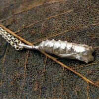 Sterling silver butterfly chrysalis pendant on skeleton leaf
