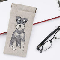 An embroidered linen snap top glasses case featuring a schnauzer motif by Kate Sproston Design