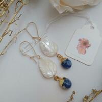 Gold filled earrings with carved mother of pearl leaves and sodalite drops