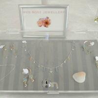 Display case with gold and silver jewellery with aquamarine, drusy quartz, Herkimer diamonds, topaz and freshwater pearls