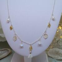 Sterling silver charm necklace with freshwater pearls, citrine, rainbow moonstone and gold vermeil leaf charms