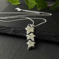 Silver pendant depicting three ivy leaves