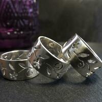 Three wide rings featuring cut out trailing jasmine design
