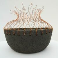 Black stoneware bowl with copper wire weaving