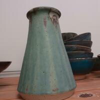 Tall unevenly glazed stoneware vase