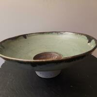 Open footed stoneware bowl with manganese inner basin and rim