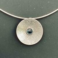 Silver swirls pendant with London Blue topaz