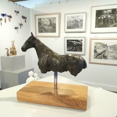 The Gallery at the Guild horse sculpture, line and wash paintings, ceramic fish
