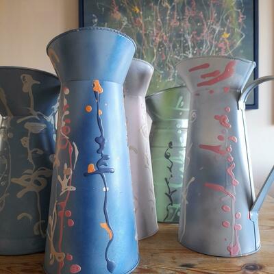 Metal jugs painted as expressionist style 