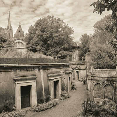 Highgate Cemetery. I wanted to show the lovely Victorian atmosphere in this peaceful  cemetery. I also wanted the details in the buildings to show without it being overly sharp. I used my medium format Pentax film camera and monochrome film. To give the image a vintage feeling I toned it to a soft sepia.