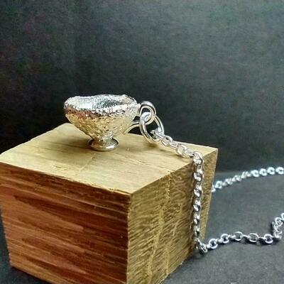 Sterling silver acorn cup teacup pendant on reclaimed oak wood