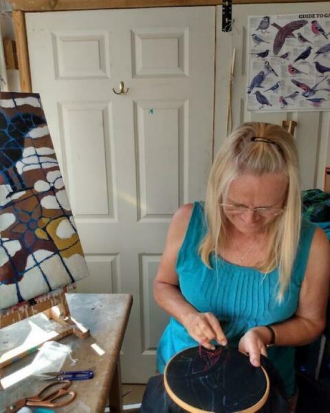Busy embroidering in the garden studio.