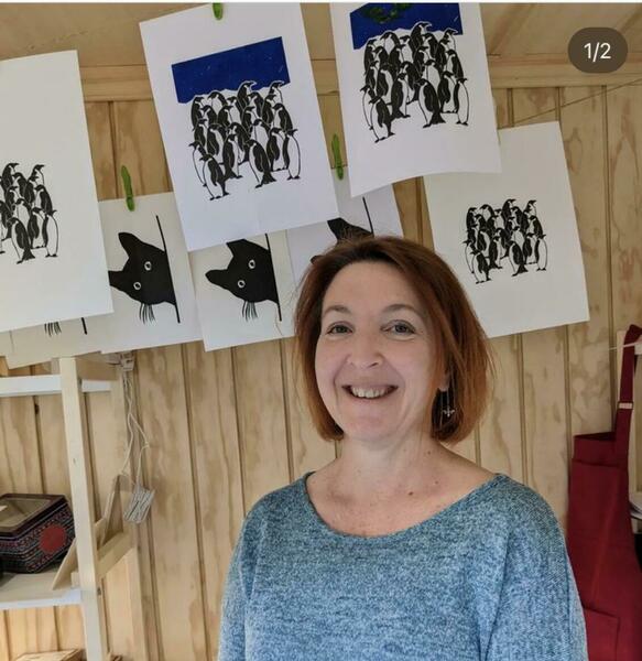 Lorna in studio with prints drying