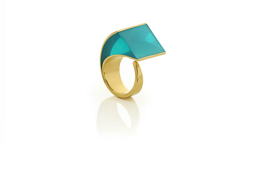 U.F.O Conchoidal 2. A statement ring in gold plated sterling silver and translucent sea blue resin from the U.F.O, Unique Finger Ornaments, collection. The U.F.O collection is inspired by the forms, structures and colours of precious and semi-precious stones in their natural forms. 