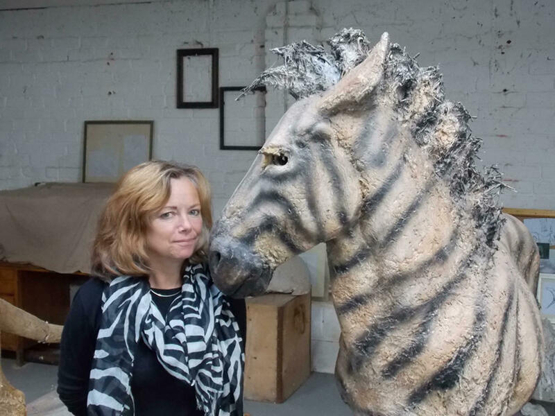Deborah and full-size Zebra sculpture in the studio.