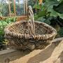 Willow Gathering Basket resting on vegetable bed
