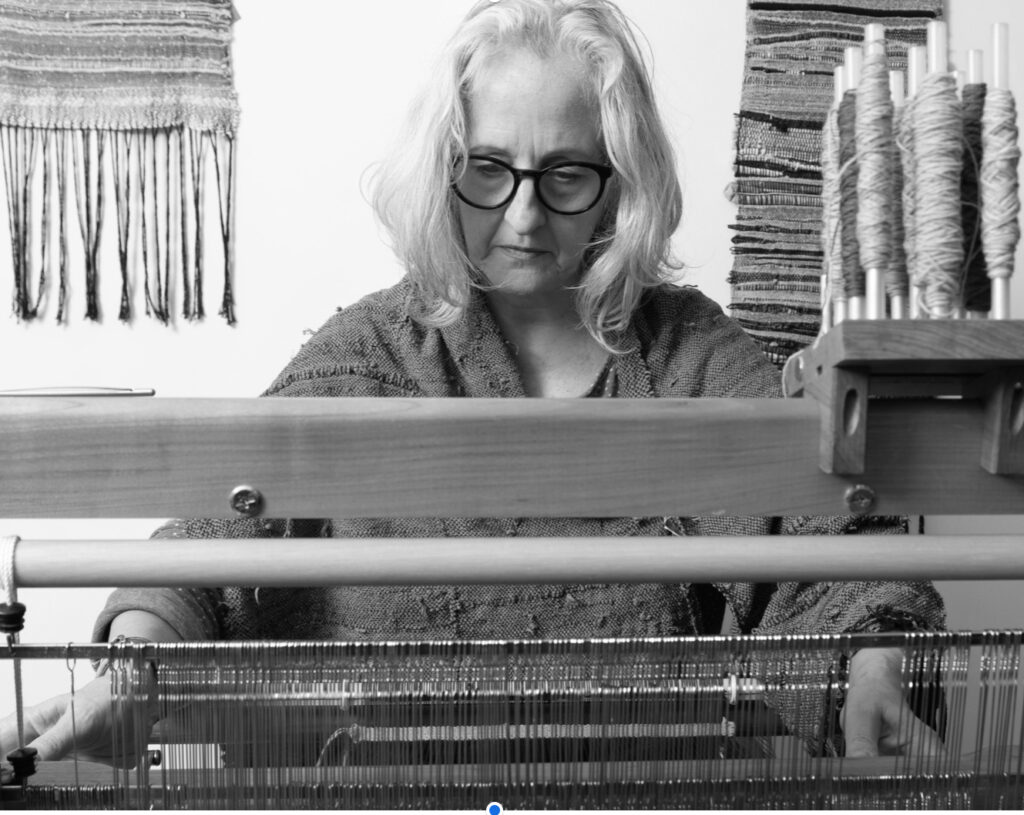 Amanda I’Anson weaving in her SAORI weaving loom