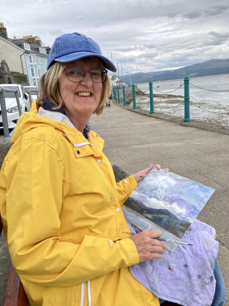 Marie Calvert painting en plein air in Wales.