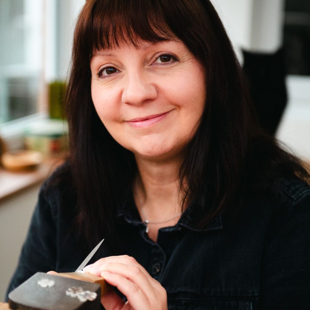 Paula Wilkinson, silversmith at her workbench