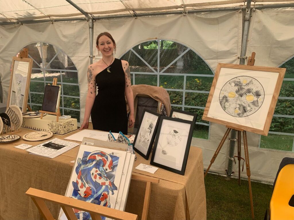Libby exhibiting at an art show