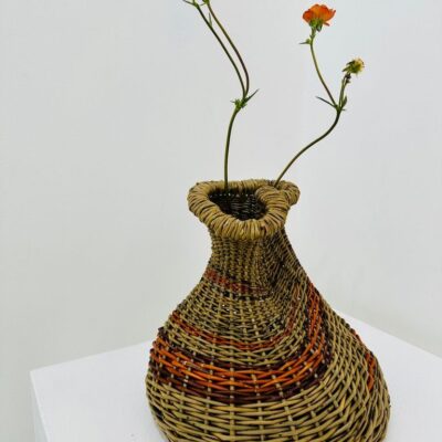 Clare Shilvock - Warwickshire Willow Sculptural vase vessel Dicky Meadows with Orange Stripe and two orange flowers