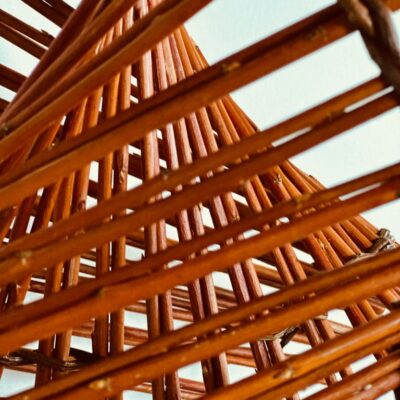 Clare Shilvock Warwickshire Willow Close Up image of Willow sculpture mobius strip in orange willow