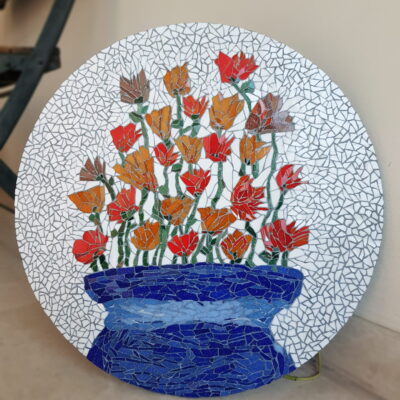 Moora Moora Mosaics My Niece's Flowers mosaiced using vitreous glass and broken dinner plate mosaiced on a 16 inch round board