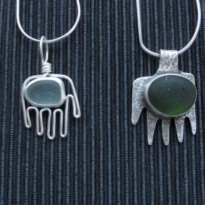 Seaglass bezel set in sterling silver hands