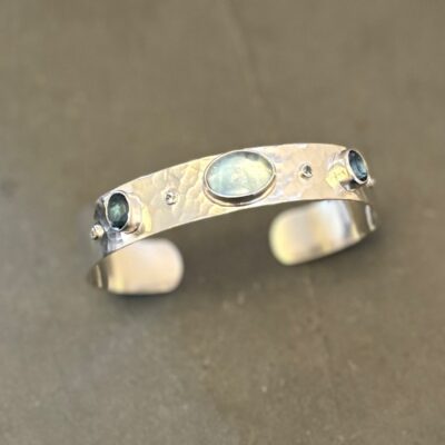 Sterling silver hammered cuff bracelet with aquamarine and sapphire gemstones