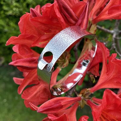 A silver bangle designed for a client