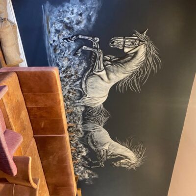  Wall painting approximately 20ft I tried to almost capture a mirror image of horses kicking up dust escaping to see the two arena’s either side of the wall