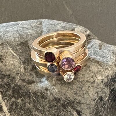 Remodelled gold and mixed gemstone stacking ring set